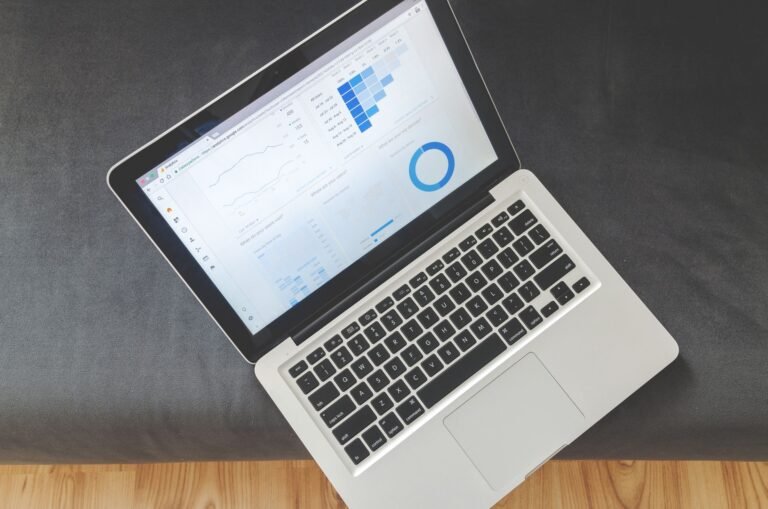 Comparing dental SEO and Google Ads on a laptop