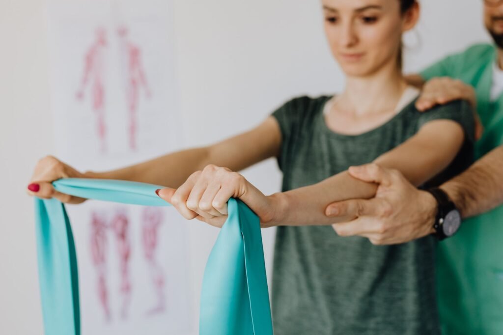 Physical therapist treating a patient recovering from an auto accident injury