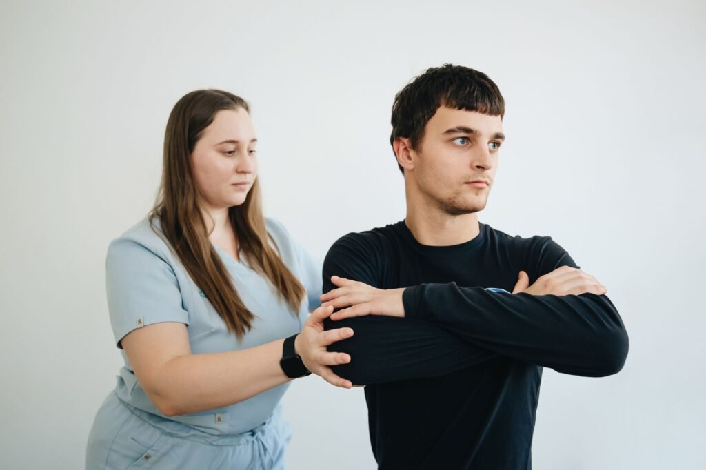 Physical therapist working with a patient on workplace injury rehabilitation