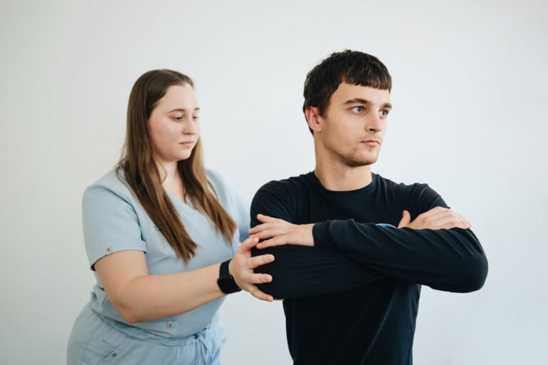 Physical therapist working with a patient on workplace injury rehabilitation
