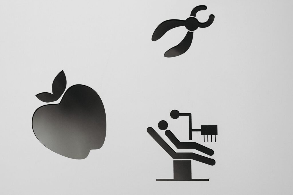 Dental practice logo and branding materials on a desk