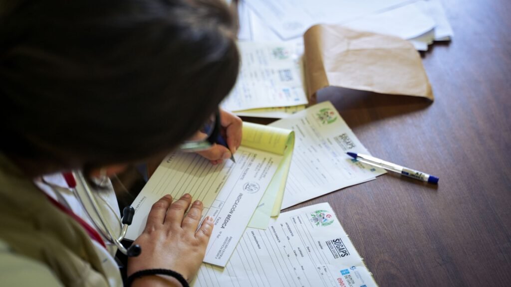 Physical therapist handing discharge paperwork to a patient