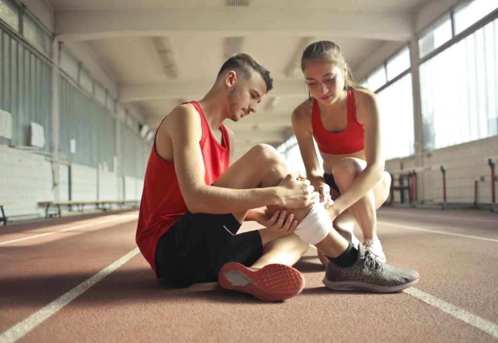 Physical therapist working with an athlete on rehabilitation exercises